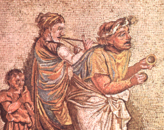 [ilustração: Músicos de rua. Mosaico (pormenor). Pompeia.
]
